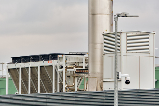 Middenmeer Netherlands 17 May 2026 View of Microsoft datacenters western europe on Agriport along the A7 featuring industrial cooling fans exhaust stack and security camera.
