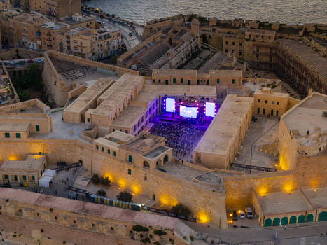 Aerial view of a music concert at Fort St. Elmo with a crowd and stage screens in Valletta Port Region Malta. Aerial view of a music concert at Fort St. Elmo with a crowd and stage screens in Valletta Port Region Malta.