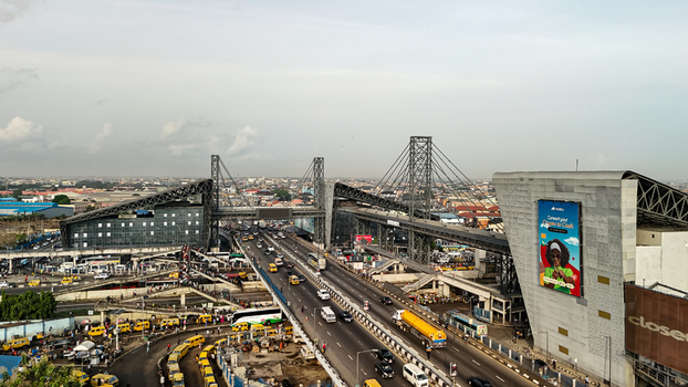 Lagos Nigeria 23 March 2026 Aerial view of a bustling highway cutting through the city framed by the iconic Tin Can Island Port complex and the vibrant billboards. Lagos Nigeria 23 March 2026 Aerial view of a bustling highway cutting through the city framed by the iconic Tin Can Island Port complex and the vibrant billboards.