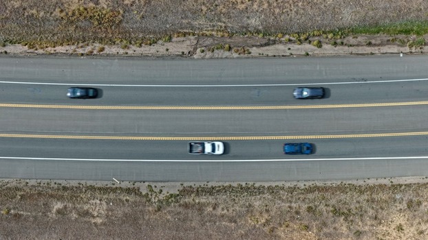 Aerial view of a multi lane highway with cars driving along the asphalt road in Golden Colorado United States.