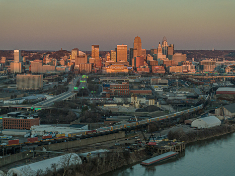 Aerial view of the city skyline basking in the warm hues of the setting sun casting long shadows across the urban landscape Cincinnati Ohio United States. Aerial view of the city skyline basking in the warm hues of the setting sun casting long shadows across the urban landscape Cincinnati Ohio United States.