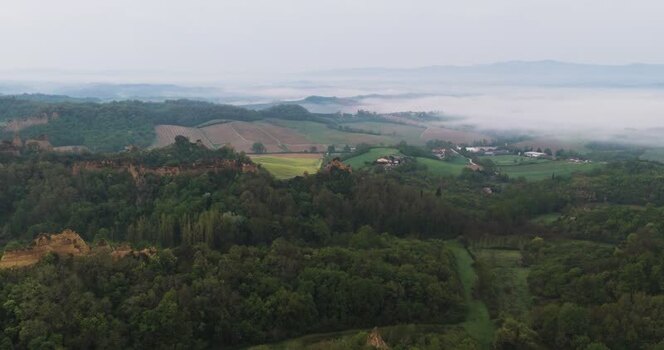 Aerial view of the Balze del Valdarno rock formations and misty hills Italy. Aerial view of the Balze del Valdarno rock formations and misty hills Italy.