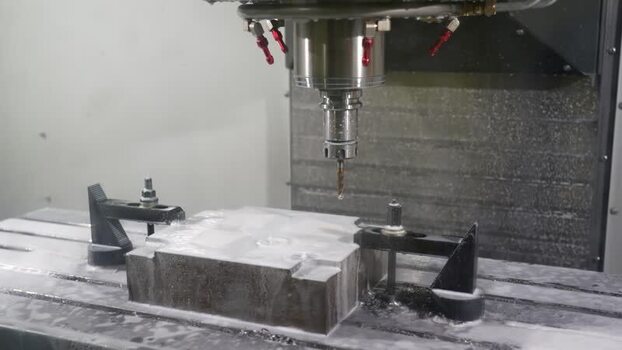 View of a CNC machine drilling a metal block in Bogura Bangladesh.