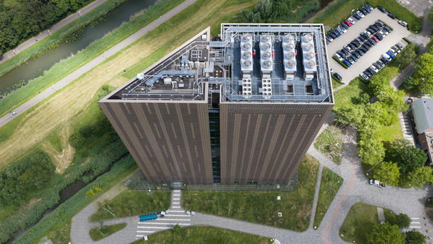 Amsterdam Netherlands 09 June 2026 Aerial view of Digital Realty Amsterdam AMS17 data center with its distinctive triangular roof cooling units and surrounding green landscape. Amsterdam Netherlands 09 June 2026 Aerial view of Digital Realty Amsterdam AMS17 data center with its distinctive triangular roof cooling units and surrounding green landscape.