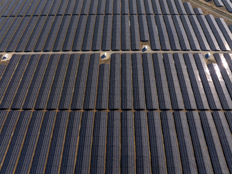 Aerial view of a large scale solar farm with rows of photovoltaic panels arranged in a grid pattern in Lovech Lovech Bulgaria. Aerial view of a large scale solar farm with rows of photovoltaic panels arranged in a grid pattern in Lovech Lovech Bulgaria.