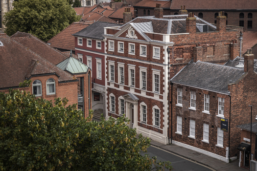 Aerial view of historic brick buildings and traditional rooftops in the city center of York England United Kingdom.