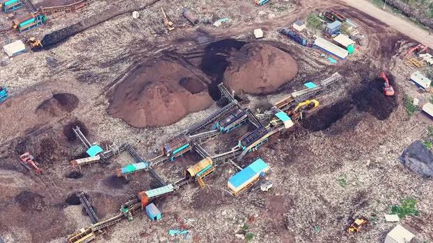 Aerial view of waste recycling unit with machinery in India. Aerial view of waste recycling unit with machinery in India.