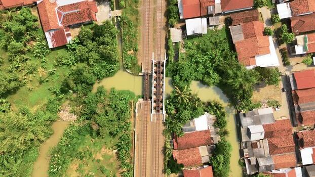 Aerial view of a railway bridge over a river in Indonesia. Aerial view of a railway bridge over a river in Indonesia.