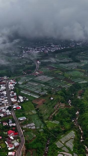 Aerial view of terraced fields and village in Bali Indonesia.