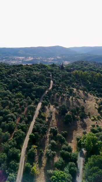 Aerial view of La Cartuja de Cazalla and green hills Spain. Aerial view of La Cartuja de Cazalla and green hills Spain.