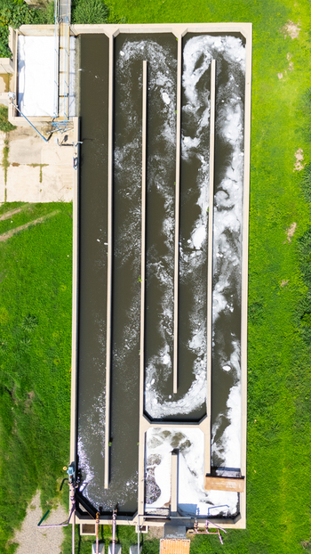 Aerial view of wastewater treatment plant s rectangular tanks contrasting with the surrounding green fields Puerto Vallarta Mexico. Aerial view of wastewater treatment plant s rectangular tanks contrasting with the surrounding green fields Puerto Vallarta Mexico.