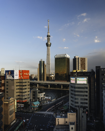 View of Tokyo Skytree piercing the skyline framed by golden skyscrapers and bustling streets below reflecting the vibrant life of the city Bunkyo City Tokyo Japan. View of Tokyo Skytree piercing the skyline framed by golden skyscrapers and bustling streets below reflecting the vibrant life of the city Bunkyo City Tokyo Japan.