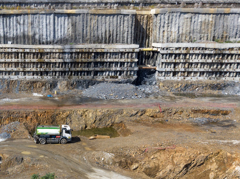 Aerial view of a large construction site with deep excavation concrete retaining walls and a water truck on the dirt ground in Istanbul Istanbul Turkiye. Aerial view of a large construction site with deep excavation concrete retaining walls and a water truck on the dirt ground in Istanbul Istanbul Turkiye.