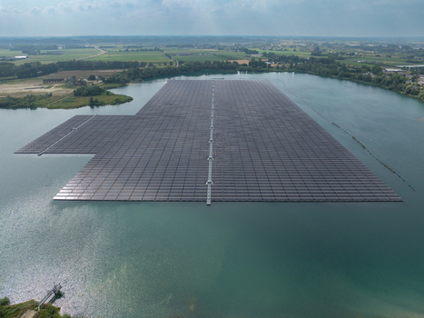Aerial view of a large floating solar farm on a lake in the Netherlands. Aerial view of a large floating solar farm on a lake in the Netherlands.