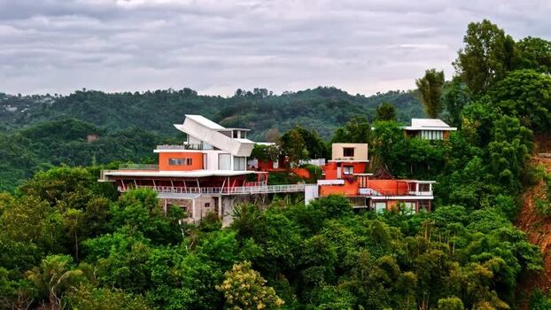 Aerial view of modern villa in tropical forest Indonesia.