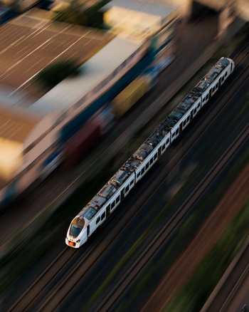 Aerial view of a modern passenger train speeding along tracks with motion blur effect in Dakar Dakar Region Senegal.