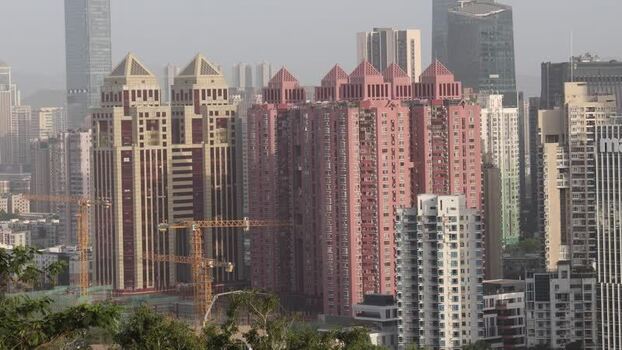 View of modern high rise buildings and construction in Shenzhen China. View of modern high rise buildings and construction in Shenzhen China.