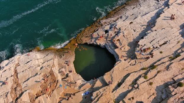 Aerial view of Giola natural pool on the rocky coast of Greece. Aerial view of Giola natural pool on the rocky coast of Greece.