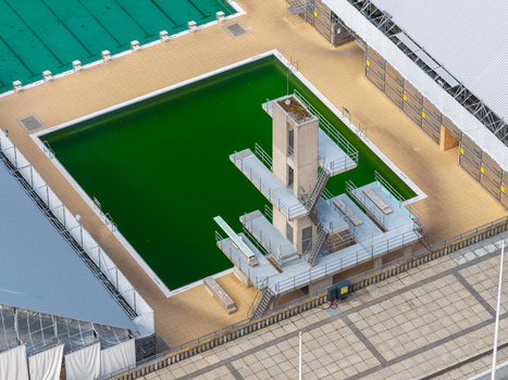 Berlin Germany 26 September 2026 Aerial view of the diving platforms and green swimming pool at the Olympiastadion Berlin featuring concrete structures and paved areas.