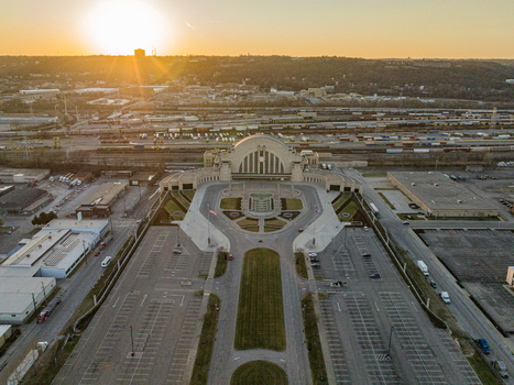 Aerial view of the iconic Union Terminal bathed in the golden light of the setting sun its art deco architecture casting long shadows across the landscape Cincinnati Ohio United States. Aerial view of the iconic Union Terminal bathed in the golden light of the setting sun its art deco architecture casting long shadows across the landscape Cincinnati Ohio United States.