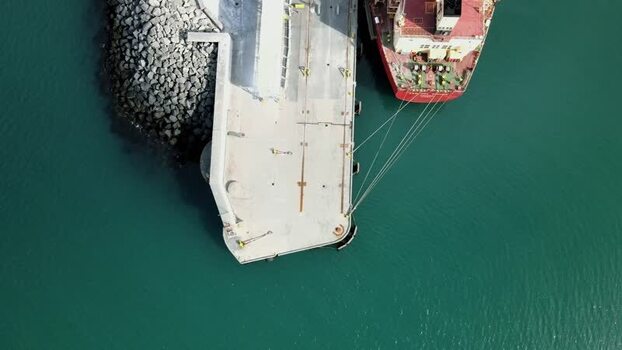 Aerial view of a cargo ship moored at the port in Hafnarfjordur Iceland.