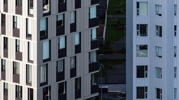Aerial view of modern apartment complex with geometric metal cladding and windows in Iceland. Aerial view of modern apartment complex with geometric metal cladding and windows in Iceland.
