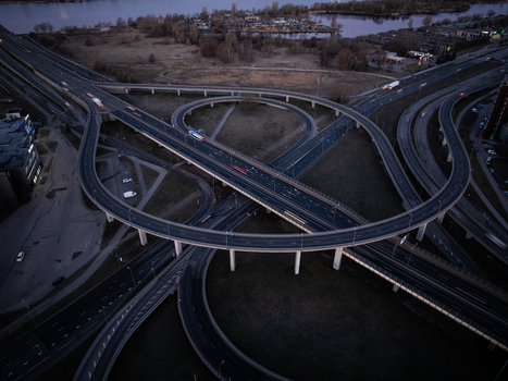 Aerial view of the Salu Bridge and Krasta Street interchange featuring complex multi level highway ramps concrete overpasses and evening traffic lights in Riga Latvia. Aerial view of the Salu Bridge and Krasta Street interchange featuring complex multi level highway ramps concrete overpasses and evening traffic lights in Riga Latvia.