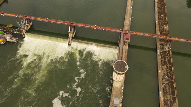 Aerial view of the weir on the Seine river with concrete structures and flowing water in Chartrettes Ile de France France. Aerial view of the weir on the Seine river with concrete structures and flowing water in Chartrettes Ile de France France.
