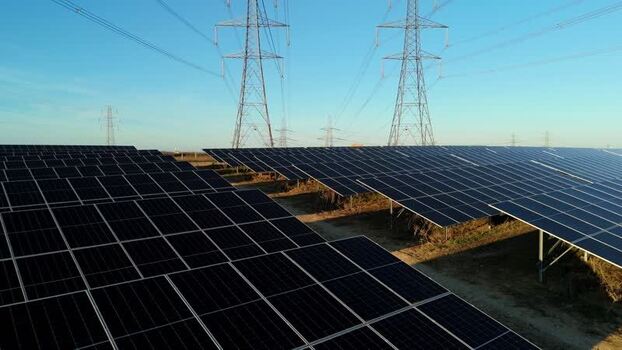Aerial view of solar farm and pylons United Kingdom. Aerial view of solar farm and pylons United Kingdom.