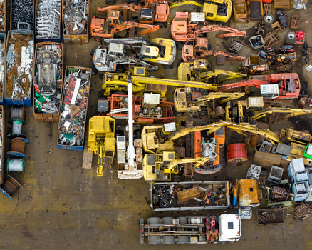 Aerial view of scrapped cars and crushed metal debris piled in a junkyard and recycling site in Hoogeveen Drenthe Netherlands. Aerial view of scrapped cars and crushed metal debris piled in a junkyard and recycling site in Hoogeveen Drenthe Netherlands.