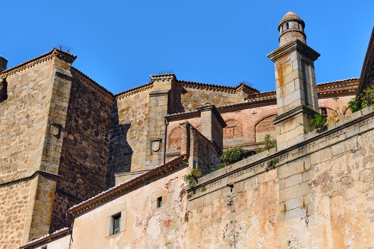 Plasencia Spain 03 December 2025 View of historic stone walls and ancient architecture within the walled city under a clear blue sky. Plasencia Spain 03 December 2025 View of historic stone walls and ancient architecture within the walled city under a clear blue sky.