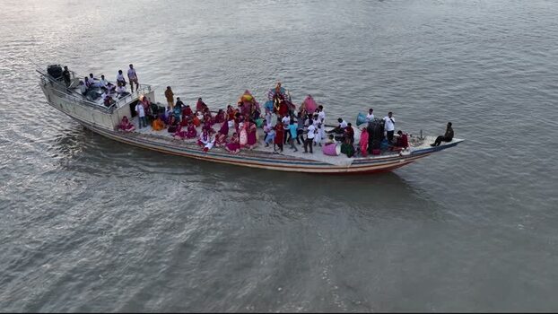 Aerial view of a crowded boat on a river in Bogura Bangladesh.