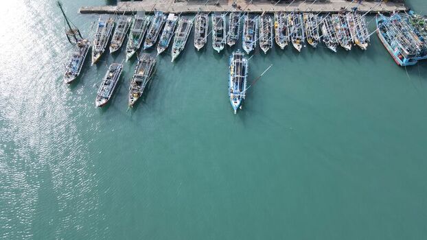 Aerial view of fishing boats moored at the harbor in Bakauheni Lampung Indonesia.