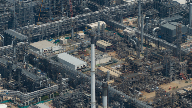 Aerial view of the Eastern Economic Corridor of Innovation EECi with its complex network of industrial pipes and tall chimneys in Tambon Pa Yup Nai Chang Wat Rayong Thailand. Aerial view of the Eastern Economic Corridor of Innovation EECi with its complex network of industrial pipes and tall chimneys in Tambon Pa Yup Nai Chang Wat Rayong Thailand.