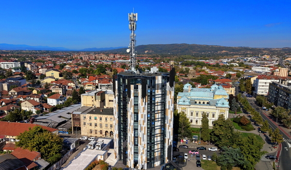 Aerial view of a modern high rise building featuring a telecommunications tower in the city center of Krusevac Rasina District Serbia. Aerial view of a modern high rise building featuring a telecommunications tower in the city center of Krusevac Rasina District Serbia.