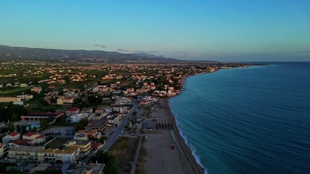 Aerial view of a coastal town with beach and sea Greece.