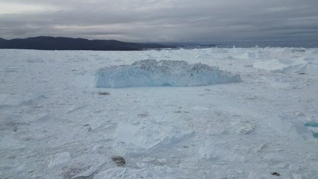 Aerial view of massive iceberg in Ilulissat Greenland. Aerial view of massive iceberg in Ilulissat Greenland.