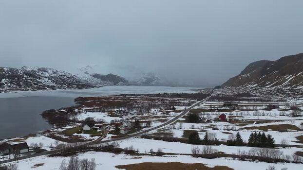 Aerial view of Lofoten mountains and icy landscape Norway.