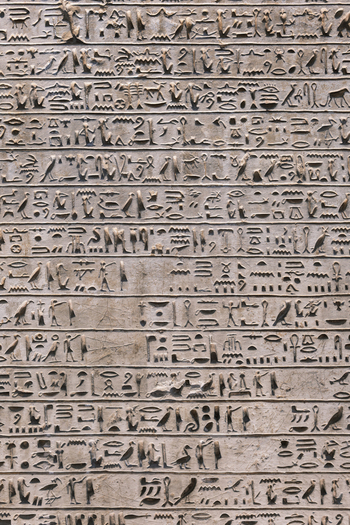 Giza Egypt 16 May 2026 View of ancient Egyptian hieroglyphs carved into a stone wall at the Grand Egyptian Museum.