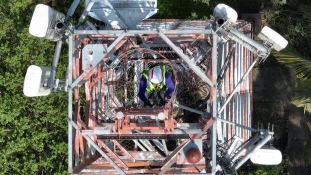 Aerial view of a technician on a telecom tower Bangladesh.