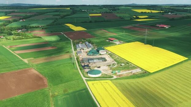 Aerial view of a biogas plant and agricultural fields Germany.