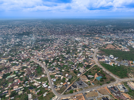 Aerial view of the sprawling urban landscape where buildings nestle among lush greenery under a vast sky Ihie Ndume Umuahia Abia Nigeria. Aerial view of the sprawling urban landscape where buildings nestle among lush greenery under a vast sky Ihie Ndume Umuahia Abia Nigeria.