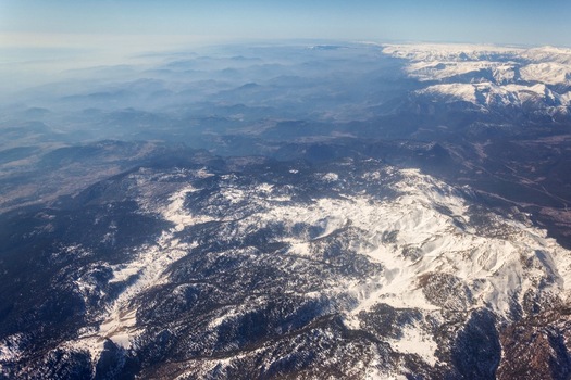 Aerial view of the snow capped Taurus Mountains featuring rugged peaks and vast terrain in Cukurova Turkey. Aerial view of the snow capped Taurus Mountains featuring rugged peaks and vast terrain in Cukurova Turkey.