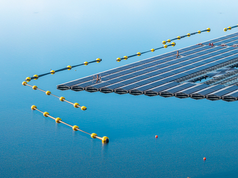 Aerial view of the floating solar farm at Cottbuser Ostsee a former open pit mine with solar panels and yellow safety buoys on the water in Cottbus Brandenburg Germany. Aerial view of the floating solar farm at Cottbuser Ostsee a former open pit mine with solar panels and yellow safety buoys on the water in Cottbus Brandenburg Germany.