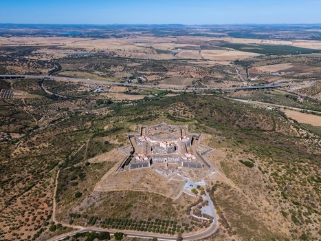 Elvas Portugal 10 September 2026 Aerial view of Forte de Nossa Senhora da Graca a star shaped historic fortress on a hilltop surrounded by dry landscape and rolling hills. Elvas Portugal 10 September 2026 Aerial view of Forte de Nossa Senhora da Graca a star shaped historic fortress on a hilltop surrounded by dry landscape and rolling hills.