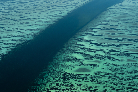 Aerial view of the intricate turquoise and deep blue ocean patterns of the Shark Bay marine environment in the Shire of Shark Bay Western Australia Australia. Aerial view of the intricate turquoise and deep blue ocean patterns of the Shark Bay marine environment in the Shire of Shark Bay Western Australia Australia.