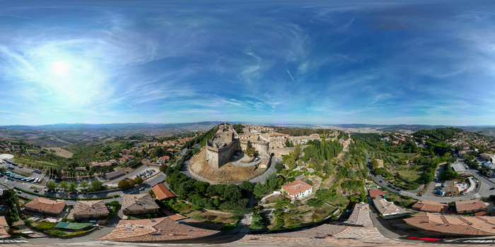 Aerial view of Bastione Porta a Selci and the historic hilltop town surrounded by the rolling hills of the Tuscan landscape Volterra Toscana Italy.