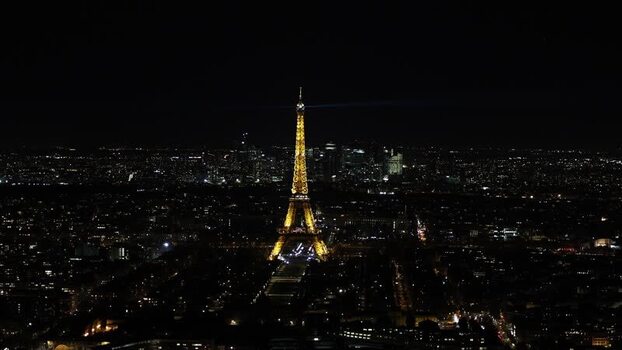 Aerial view of the illuminated Eiffel Tower at night France. Aerial view of the illuminated Eiffel Tower at night France.