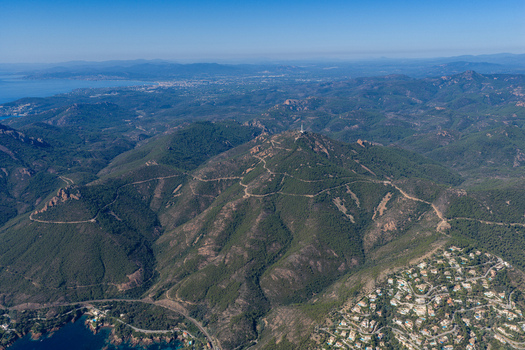 Aerial view of Le Trayas in the Esterel Massif with winding roads dense Mediterranean vegetation and the coastline of the Mediterranean Sea in Saint Raphael Provence Alpes Cote d Azur France. Aerial view of Le Trayas in the Esterel Massif with winding roads dense Mediterranean vegetation and the coastline of the Mediterranean Sea in Saint Raphael Provence Alpes Cote d Azur France.