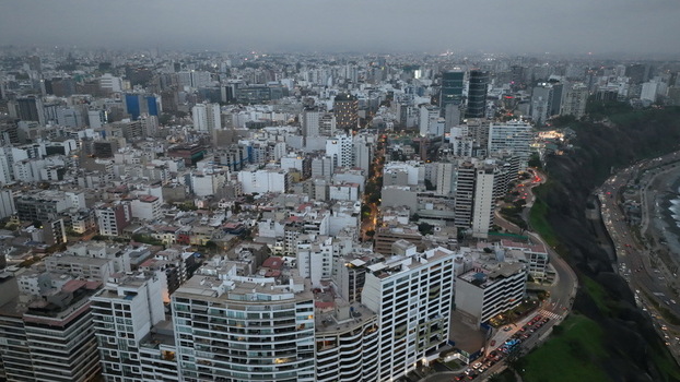 Aerial view of Love Park and the dense urban skyline of high rise buildings along the coastal cliffs of Miraflores Provincia de Lima Peru. Aerial view of Love Park and the dense urban skyline of high rise buildings along the coastal cliffs of Miraflores Provincia de Lima Peru.
